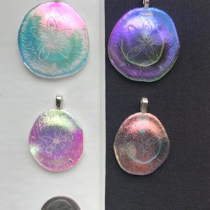 Dichroic glass sand dollar pendants
