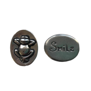 smile token with frog