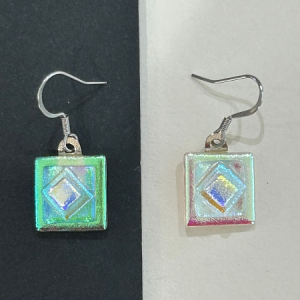 Handmade prismatic square totem dichroic glass earrings with silver hooks on black and white background