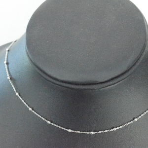 Sterling silver adjustable ball chain necklace displayed on black jewelry bust